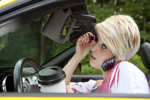 Woman on cellphone while driving car